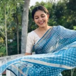 Model wearing blue color saree in designer boutique calicut
