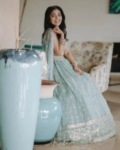 Model wearing blue color lehanga in designer boutique calicut