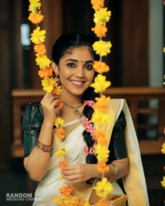 Model wearing onam set sareein designer boutique calicut