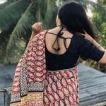 Model wearing Dabu handblocked kota daria saree in designer boutique calicut