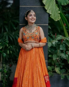 Model wearing orange color salwar in designer boutique calicut