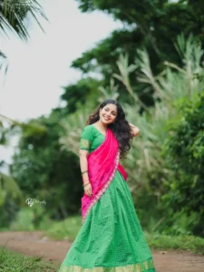 Model wearing pink&green color dhavani designer boutique calicut