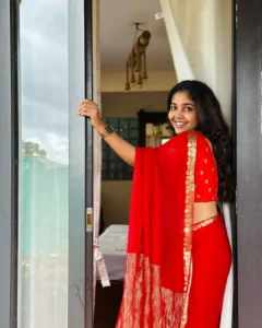 Model wearing red color saree in designer boutique calicut